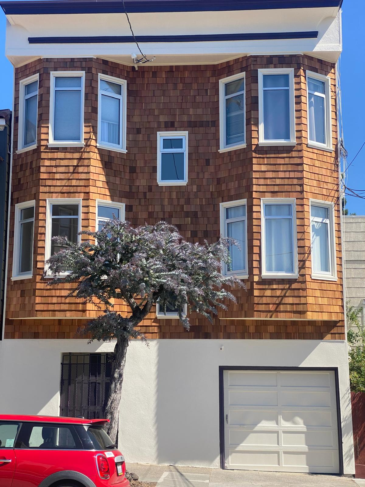 Full house exterior painting project with wood shingles, white trim, and garage in San Francisco